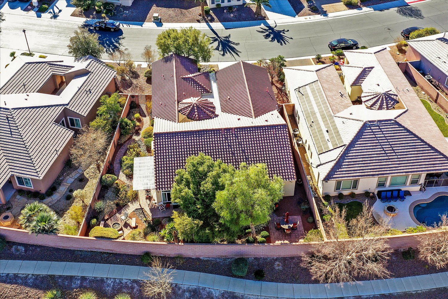 Aerial showcasing landscaped pathways around home