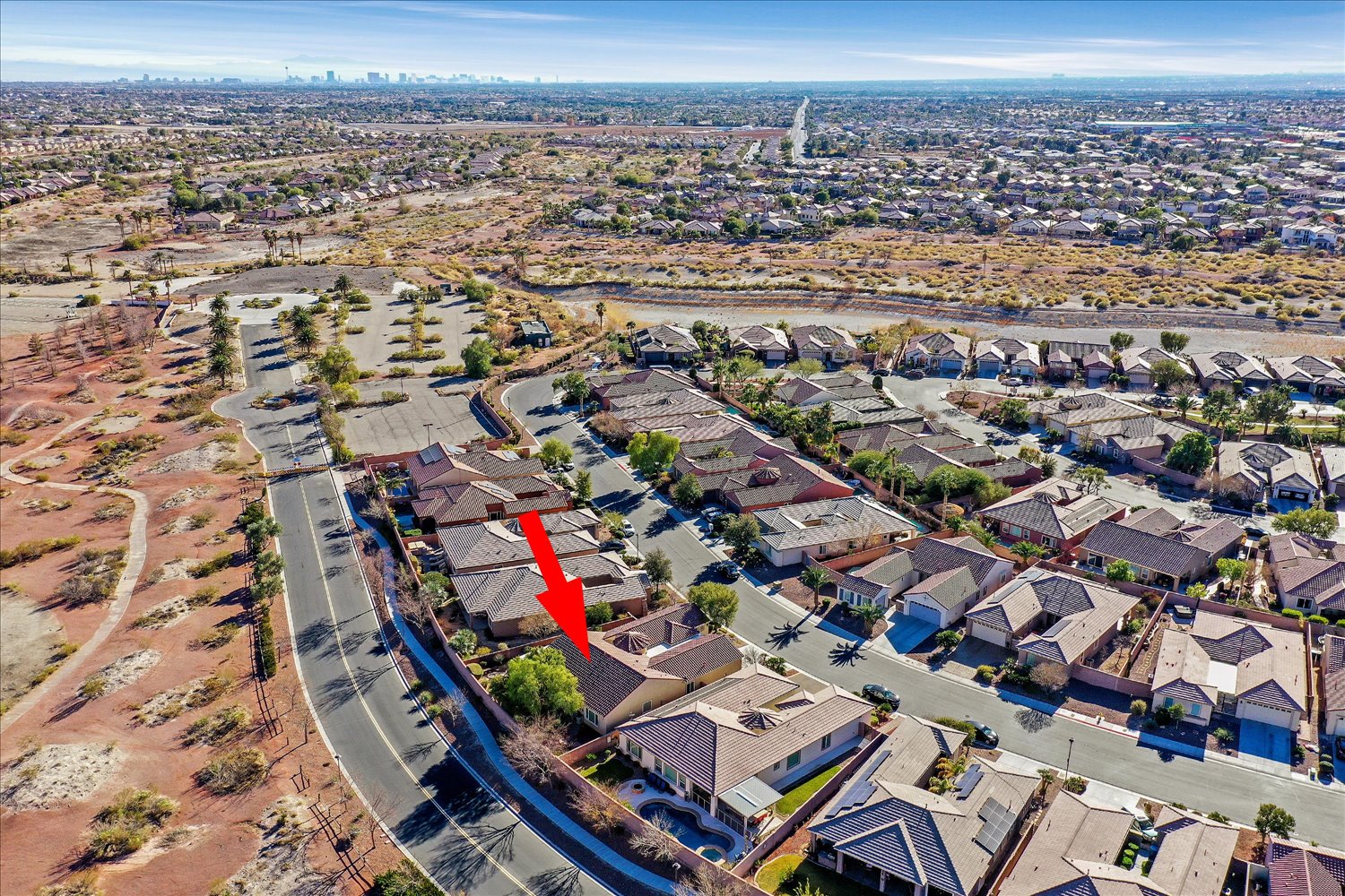 Aerial streetscape with curved roads and homes