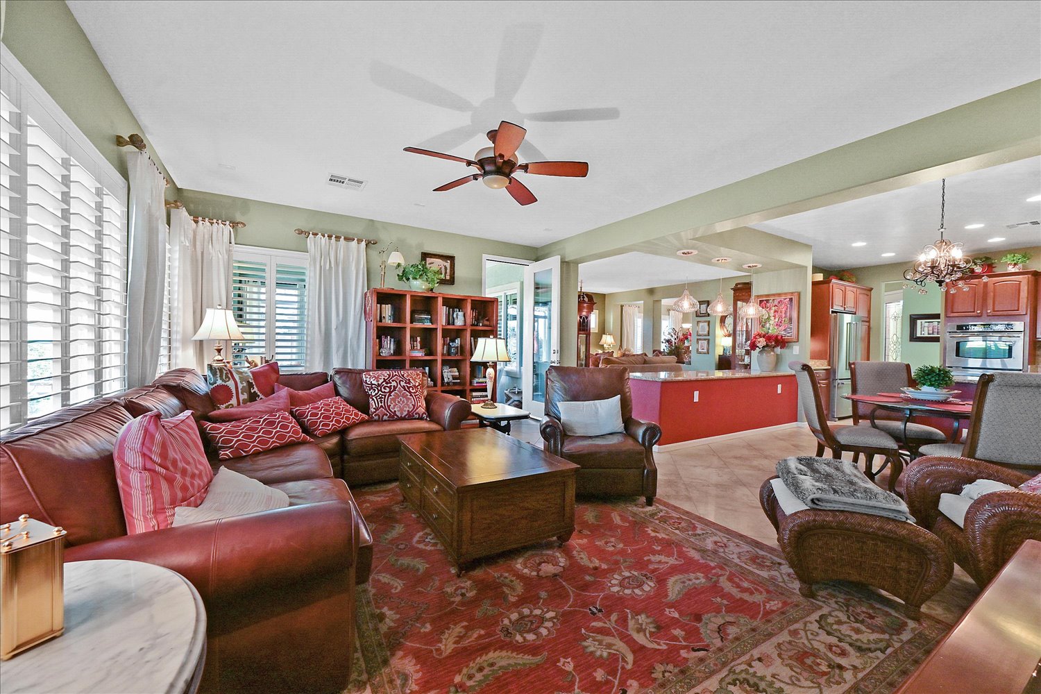 Family room overview with leather sectional and gallery wall