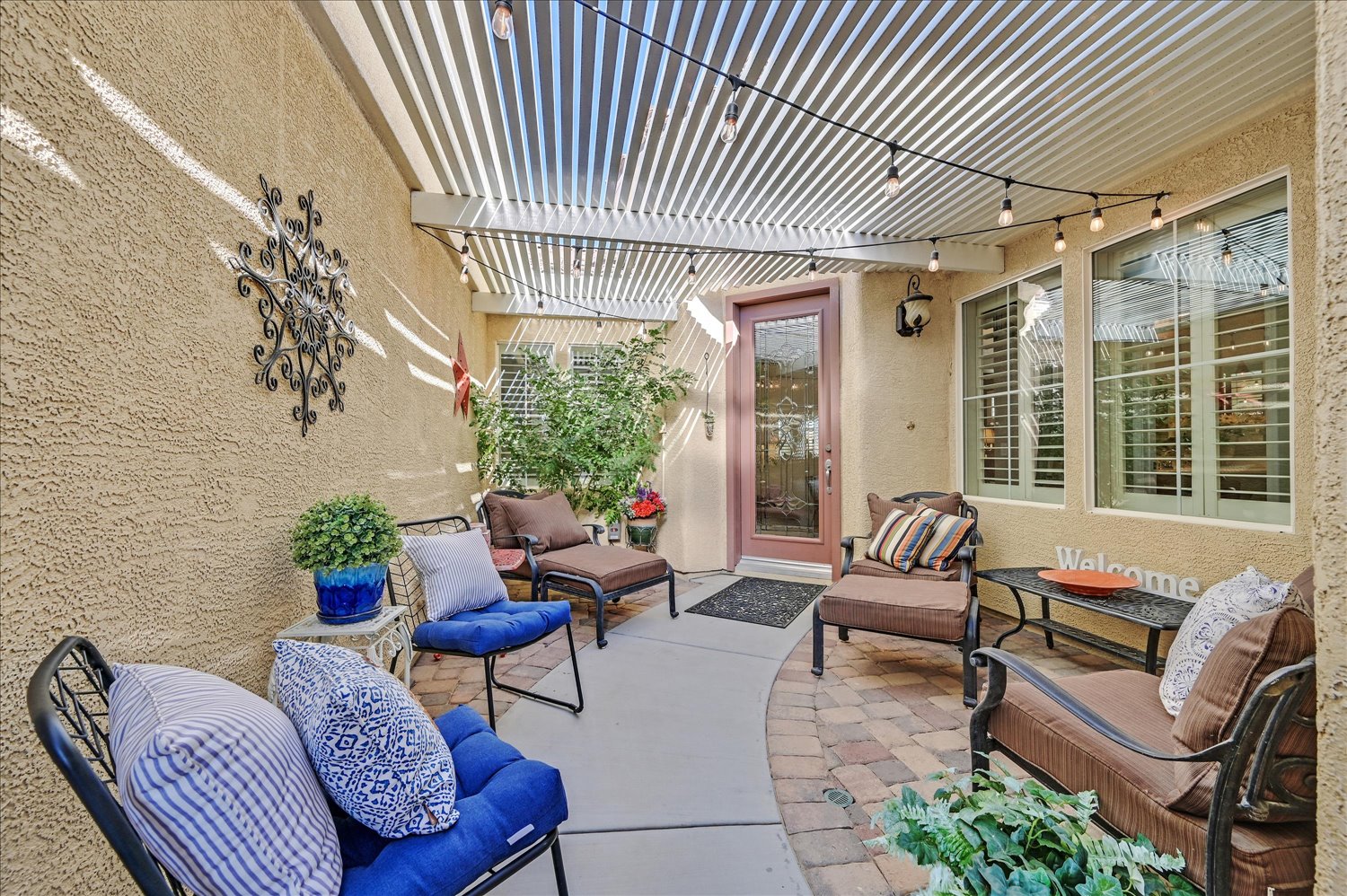 Formal living room featuring fireplace, green accent wall, and curated artwork