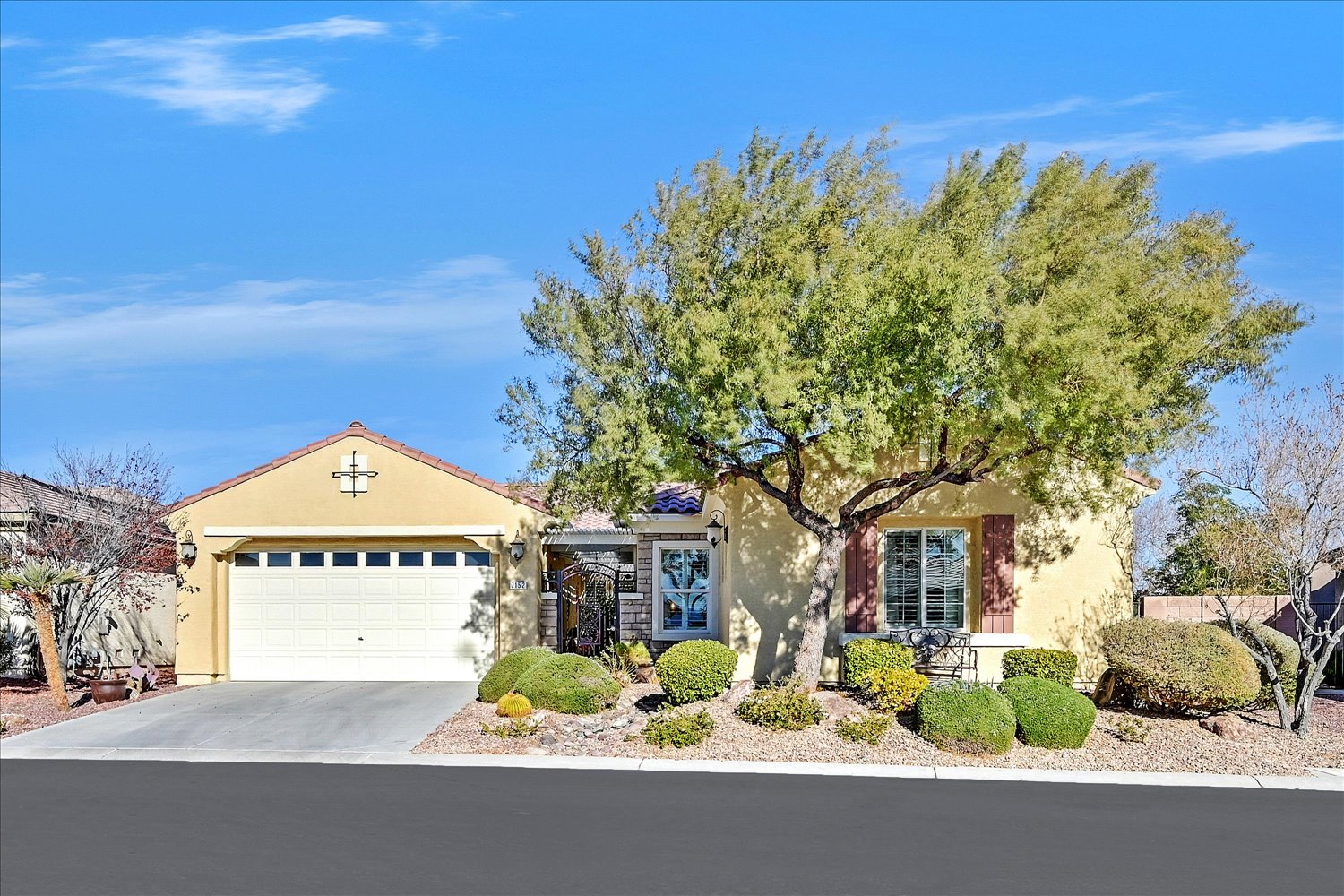 Elegant Las Vegas foyer with glass door, circular tile medallion, and sage walls