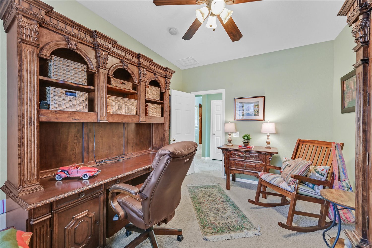 Kitchen pantry wall with pendant lights and breakfast seating