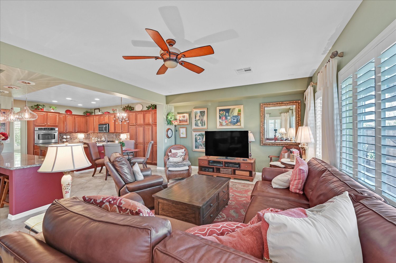 Laundry room with Samsung appliances and storage cabinets