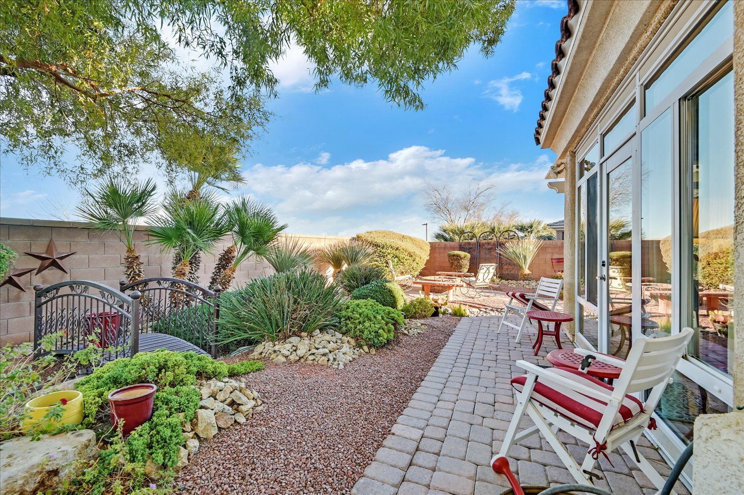 Pergola-covered patio with lounge seating and desert views